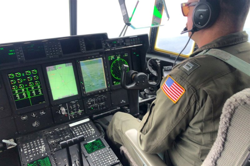 A US Coast Guard crew member aboard an HC-130 Hercules searches for the 21-foot Titan submersible about 900 miles East of Cape Cod in Boston in June, 2023. The Titan was carrying tourists to space of the Titanic disaster. File photo by US Coast Guard Petty Officer 1st Class Amber Howie/EPA-EFE