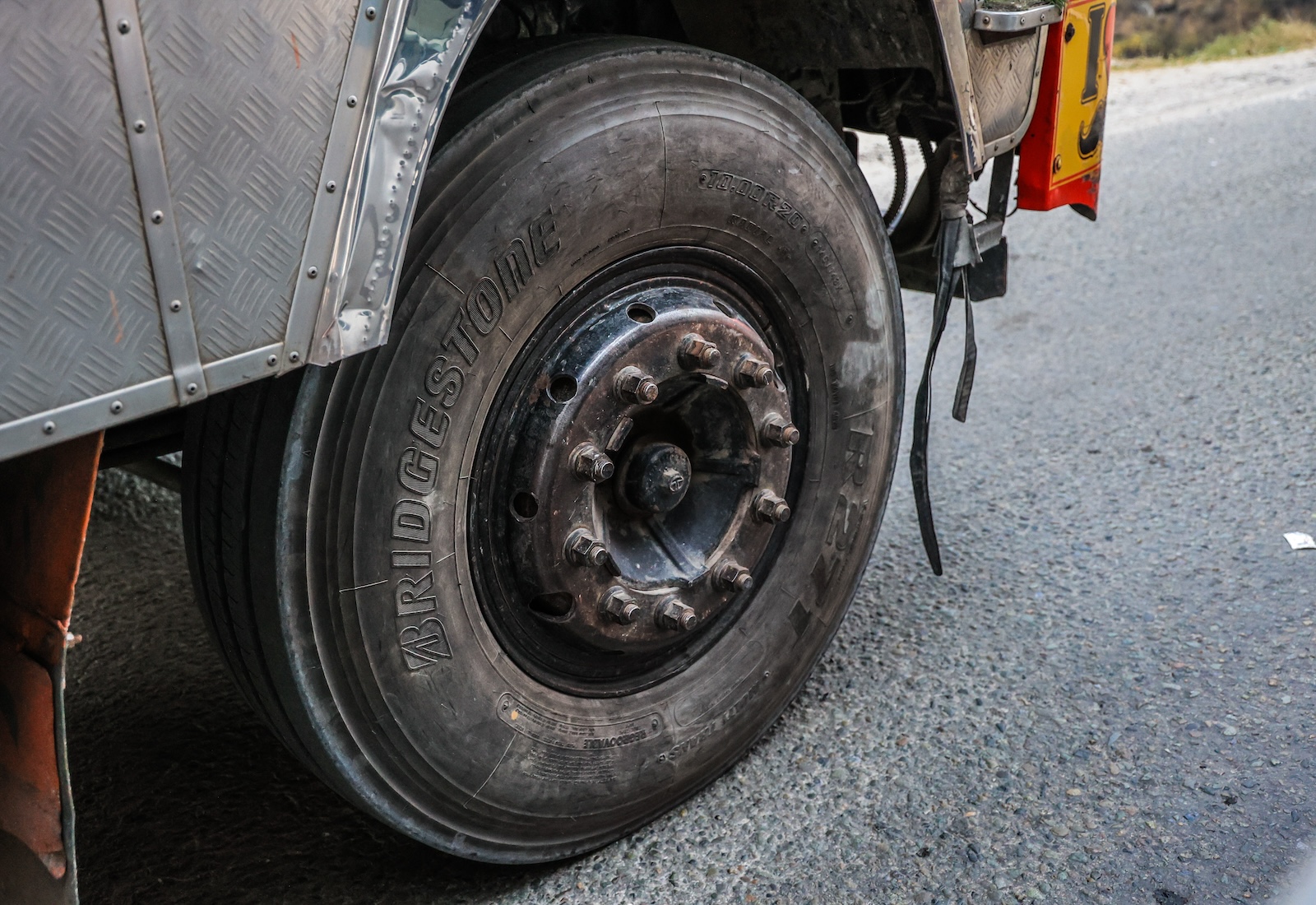 Closing the old black tire, literally "Bridgestone" written on it.